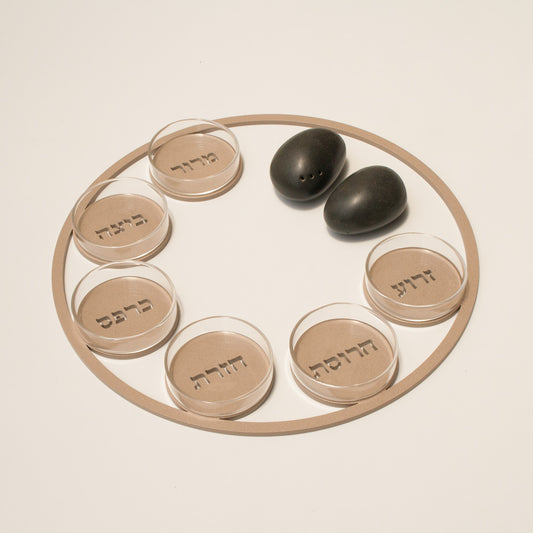 Modern and minimalist Passover Seder plate by JUDA. Clean iron frame design with six glass bowls. Made in Israel using durable materials and precise laser-cut technology. A refined Judaica piece that brings elegance, tradition, and thoughtful design to your Passover table.